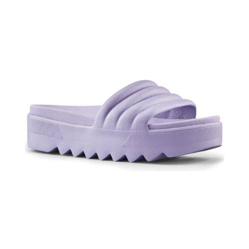 Pool Party Slide Sandal in Lavender. A solid coloured, light purple sandal with a 1.5 inch platform outsole, designed with deep grooves.