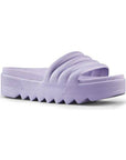 Pool Party Slide Sandal in Lavender. A solid coloured, light purple sandal with a 1.5 inch platform outsole, designed with deep grooves.