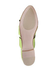 Bottom view of lime green Django & Juliette Forli mule showing smooth sole and cushioned heel for comfortable wear.