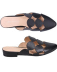 Pair of Leather Mules in black with circular cutout design, beige logo'd footbed and low heel.