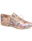 Woman's Oxford shoe in floral gold metallic leather with lace-up slip on style and a low stacked heel.