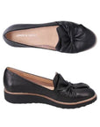 Pair of A black leather loafers with a scrunchy bow detail on the vamp and a low wedge heel.