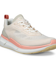 An Ecco light tan mesh sneaker with pink midsole and beige outsole. Laces are white and there is a pink heel tab.