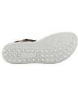 White outsole with circle pattern tread and Ecco logo stamped in middle.