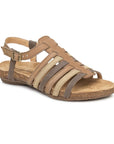 N5056 Backstrap Sandal in Honey. A strappy sandal with beige, taupe, and tan nubuck straps, a cork midsole and a brown rubber outsole. Buckle has gold hardware.