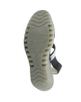 Outsole view of Women's FLY London Yaco Crossover Wedge Sandal featuring signature lugged sole for traction and branded detailing.