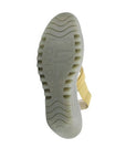Bottom sole of yellow Women's FLY London Yaco Crossover Wedge Sandal with textured grip and embossed FLY London branding.