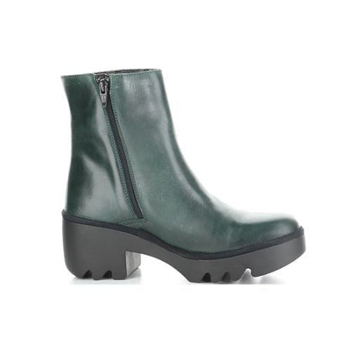 Profile of A deep green ankle boot with side zipper and a black rubber chunky low heel outsole.