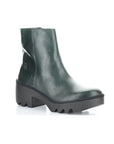 A deep green ankle boot with a black rubber chunky low heel outsole.