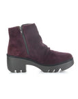 Profile of a purple ankle boot with a heel, made of genuine leather, with a zipper on the side and a lugged rubber sole.