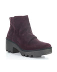 A purple ankle boot with a heel, made of genuine leather, with a zipper on the side and a lugged rubber sole.