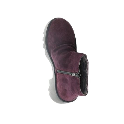Aerial of  purple ankle boot with a heel, made of genuine leather, with a zipper on the side and a lugged rubber sole.