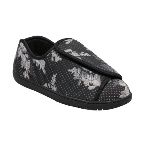 Nurse 2 Slipper in Black Floral. A closed-back slipper with a black textile upper, featuring a polka dot and grey floral design. There is an adjustable Velcro closure across the front. Outsole is black.