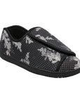 Nurse 2 Slipper in Black Floral. A closed-back slipper with a black textile upper, featuring a polka dot and grey floral design. There is an adjustable Velcro closure across the front. Outsole is black.