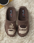 Women's Haflinger Coffee wool slippers on plush rug, featuring cute coffee-themed embroidery, ideal for cozy mornings at home.