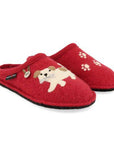 Open-back slippers with a red wool upper and a black outsole. On one slipper, there is a beige dog with a bone, as well as the Haflinger logo. On the other slipper, there are felt paw prints.