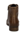 A brown leather ankle boot shown from a rear three-quarter view, featuring a low block heel and a side zipper pull, set against a plain white background.