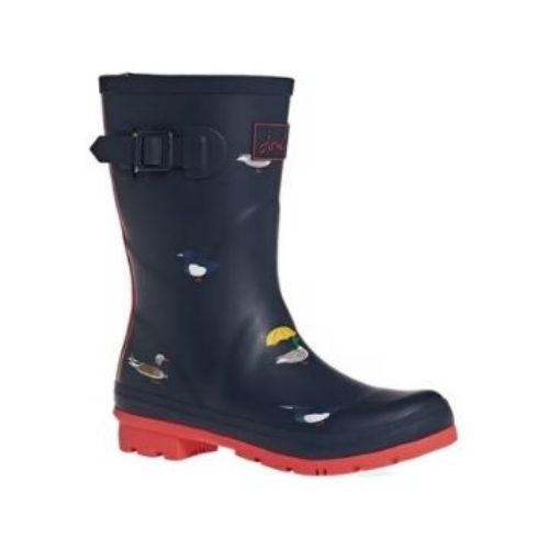Molly Mid-Height Welly in Navy Ducks. Navy blue rubber boot with red accents and a red outsole. Upper has a painted-on duck pattern.