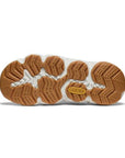 Light brown treaded outsole with yellow Keen logo and white accents.