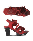 Pair of Heeled sandals in hand-painted red leather with 3D flower accents, red L'Artiste logo'd footbed and a sculpted black wedge heel.