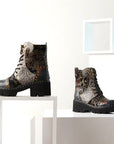 Display of Women's L'Artiste Severe ankle boots on white platforms, showcasing artistic leather design and chunky platform heel.
