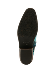 Dark brown outsole with rose pattern tread, L'artiste logo stamped in middle and low block heel.