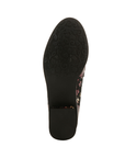 Black rubber outsole with a flower and vine tread pattern at the ball of the foot and a light treaded low block heel.
