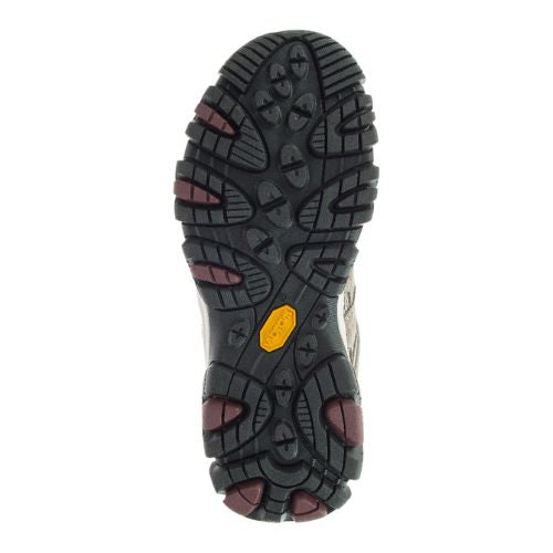 Close-up of Vibram rubber outsole on Women's Merrell Moab 3 sneaker, featuring multi-directional lugs for superior traction.