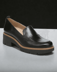 Side angle of Women's Naturalizer Darry Loafer in black leather with contrast stitching and chunky heel for modern appeal.
