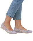 Model wearing Women's Remonte D0K04 Ballet Leather Flats in lavender, styled with jeans for a casual, flexible city look.