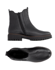 Pair of black pebbled leather Chelsea boots with a black inside zipper and a chunky black lug outsole.