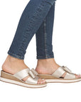 Beige Rieker D6456 platform wedge sandals worn with jeans, highlighting their versatile and fashionable design for women.