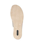 Bottom sole of beige Rieker D6456 women's slide wedge sandal, designed with anti-slip tread for secure walking.