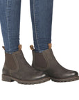 Model wearing olive Women's Remonte D8472 Chelsea Boots with jeans, showcasing waterproof ankle boot style and comfort for daily wear.