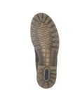 Outsole view of olive Women's Remonte D8472 Chelsea Boot with rugged tread and Remonte branding, designed for traction and durability.