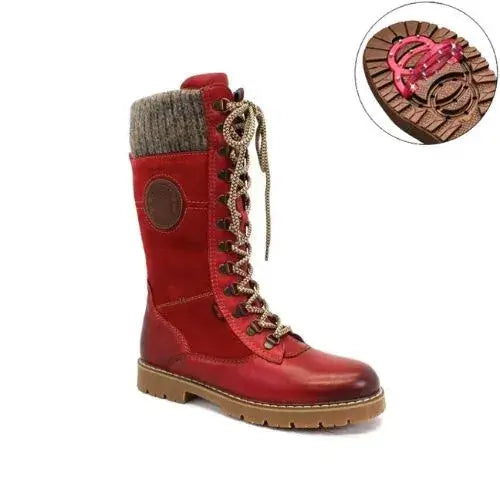 Mid-height red leather winter boot with lace closure, yarn cuff and brown outsole with grip.