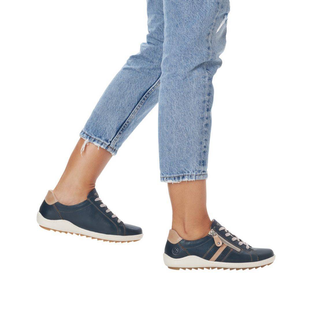 Model wearing navy Women's Remonte R1432 Lace-Up Sneakers with jeans, perfect for casual outings and all-day comfort.