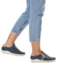 Model wearing navy Women's Remonte R1432 Lace-Up Sneakers with jeans, perfect for casual outings and all-day comfort.
