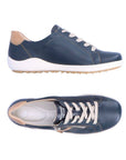 Pair of Navy Lace-up sneakers with beige accents, side zipper, accent stitching, grey Remonte logo'd footbed and white midsole.
