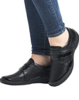 Model wearing black Women's Remonte R7600 Velcro Shoes, showcasing comfortable fit and casual style for everyday wear.