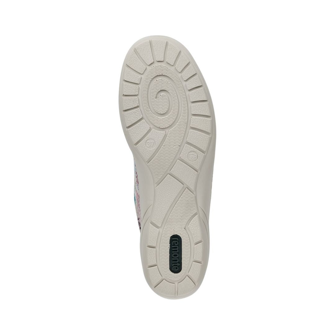 Outsole of silver multicolor Remonte R7637 Lace-Up Sneaker with spiral tread design for shock absorption and stability.