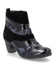 Women's Remonte D8798 heeled ankle boot in black with mixed leather textures and faux fur lining, ideal for stylish fall outfits.