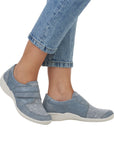 Model wearing light blue Women's Remonte R7600 Velcro Shoes with floral print, ideal for casual comfort and foot support.
