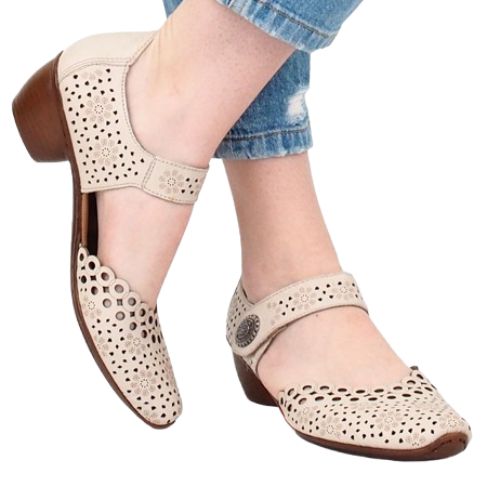 Beige  leather Mary-Jane heels worn with jeans.