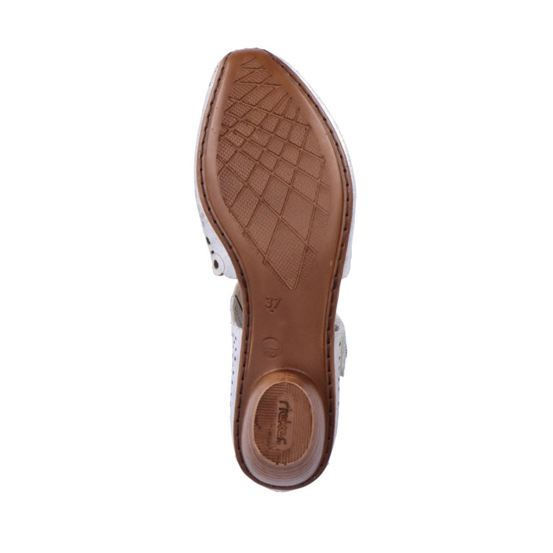 Brown outsole of low heeled Mary-Jane with Rieker logo on heel.