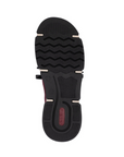 Black wave treaded outsole with red Rieker logo on heel.