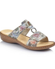 Pale floral print slide sandal with two Velcro straps, textured details and medallion accent, tan Rieker logo'd footbed and brown outsole.