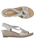 Pair of Silver wedge sandals with floral embellishments, silver medallion, tan Rieker logo'd footbed and faux espadrille midsole.