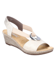 Gold slingback faux espadrille wedge sandal with elastic side straps, silver medallion, tan Rieker logo'd footbed and brown outsole.