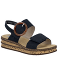 Navy Backstrap Sandal with a stylish circle buckle, two Velcro straps, tan Rieker logo'd footbed, faux cork layered midsole and brown outsole.